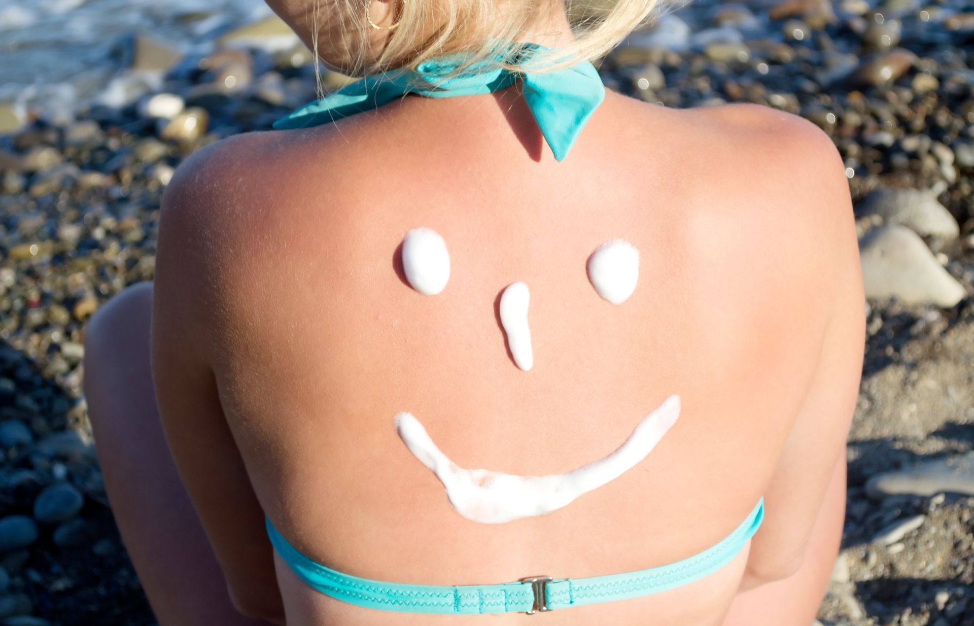 Rug met zonnebrandcrème in vorm van smiley