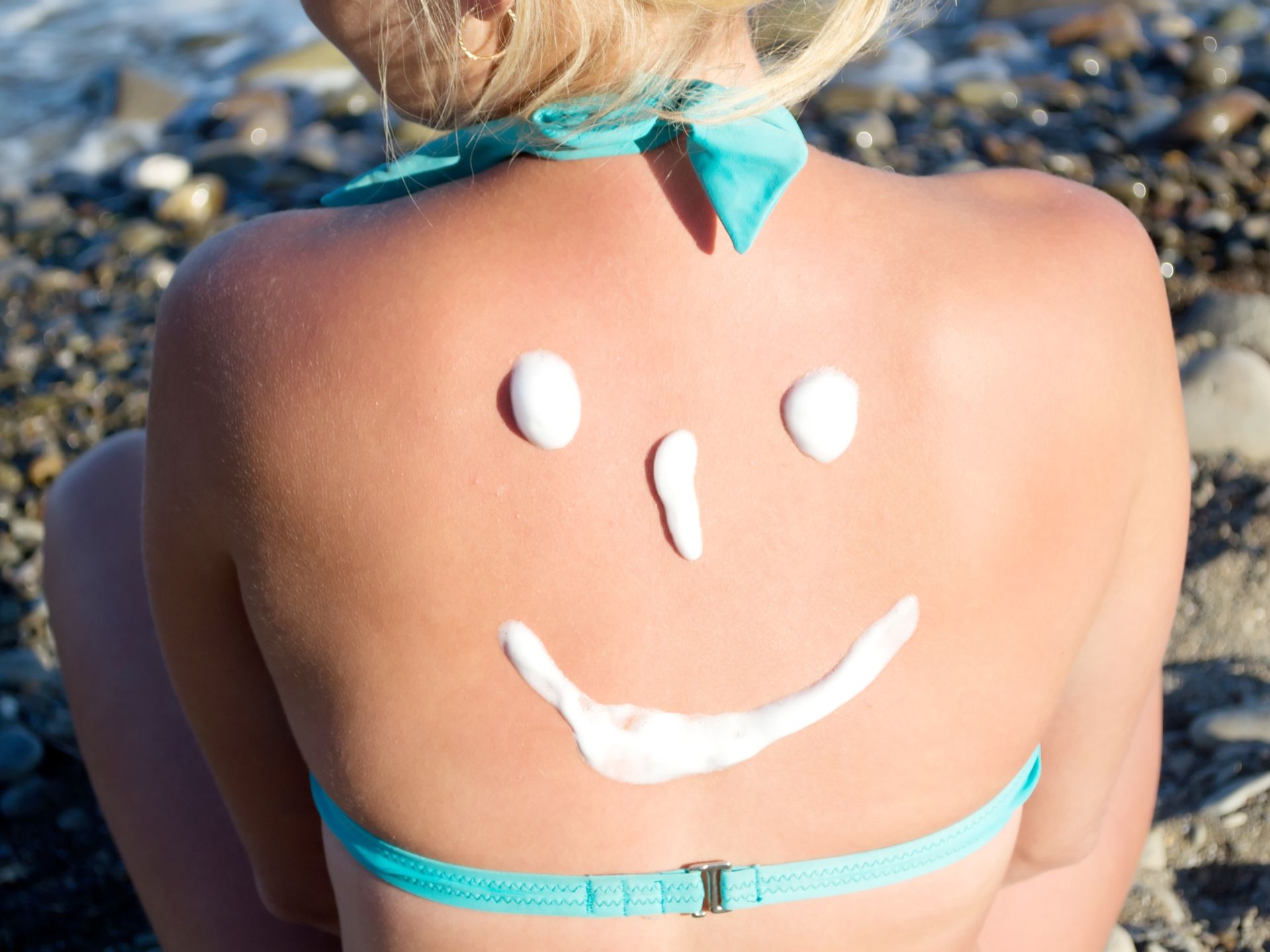 Rug met zonnebrandcrème in vorm van smiley